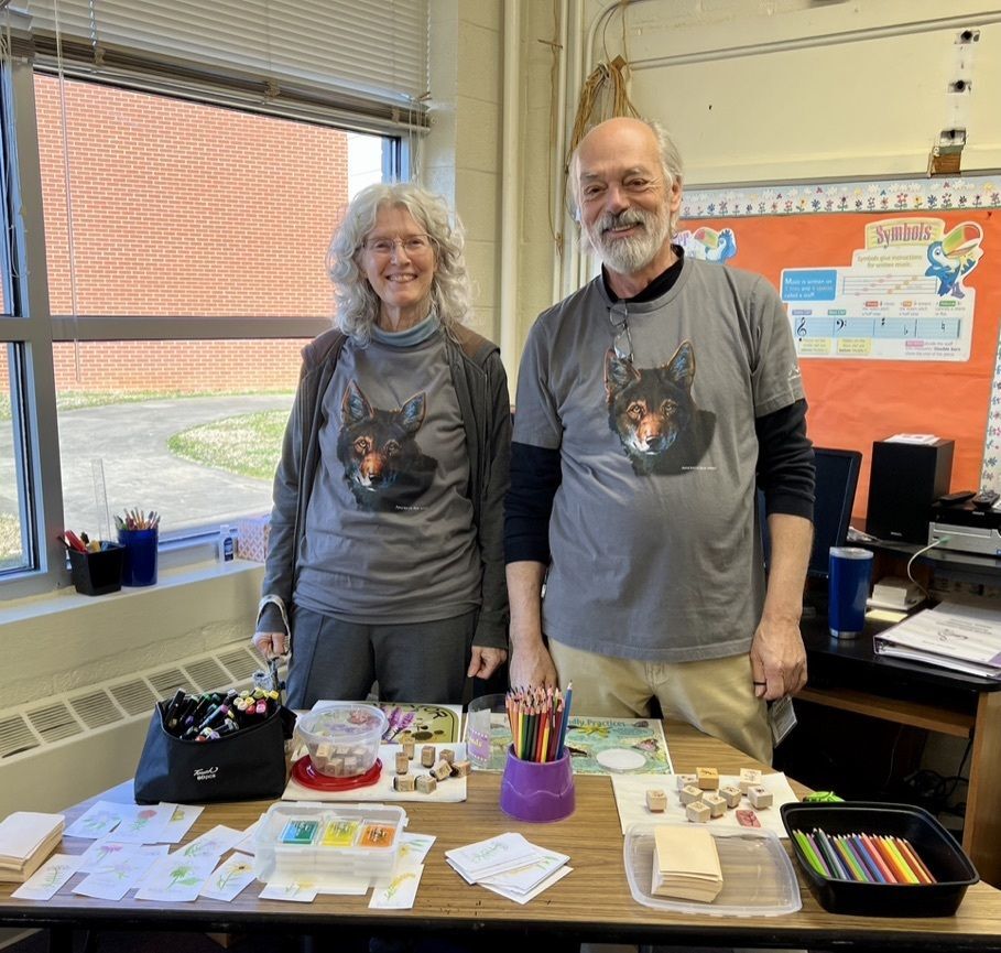 Volunteers posing with art materials