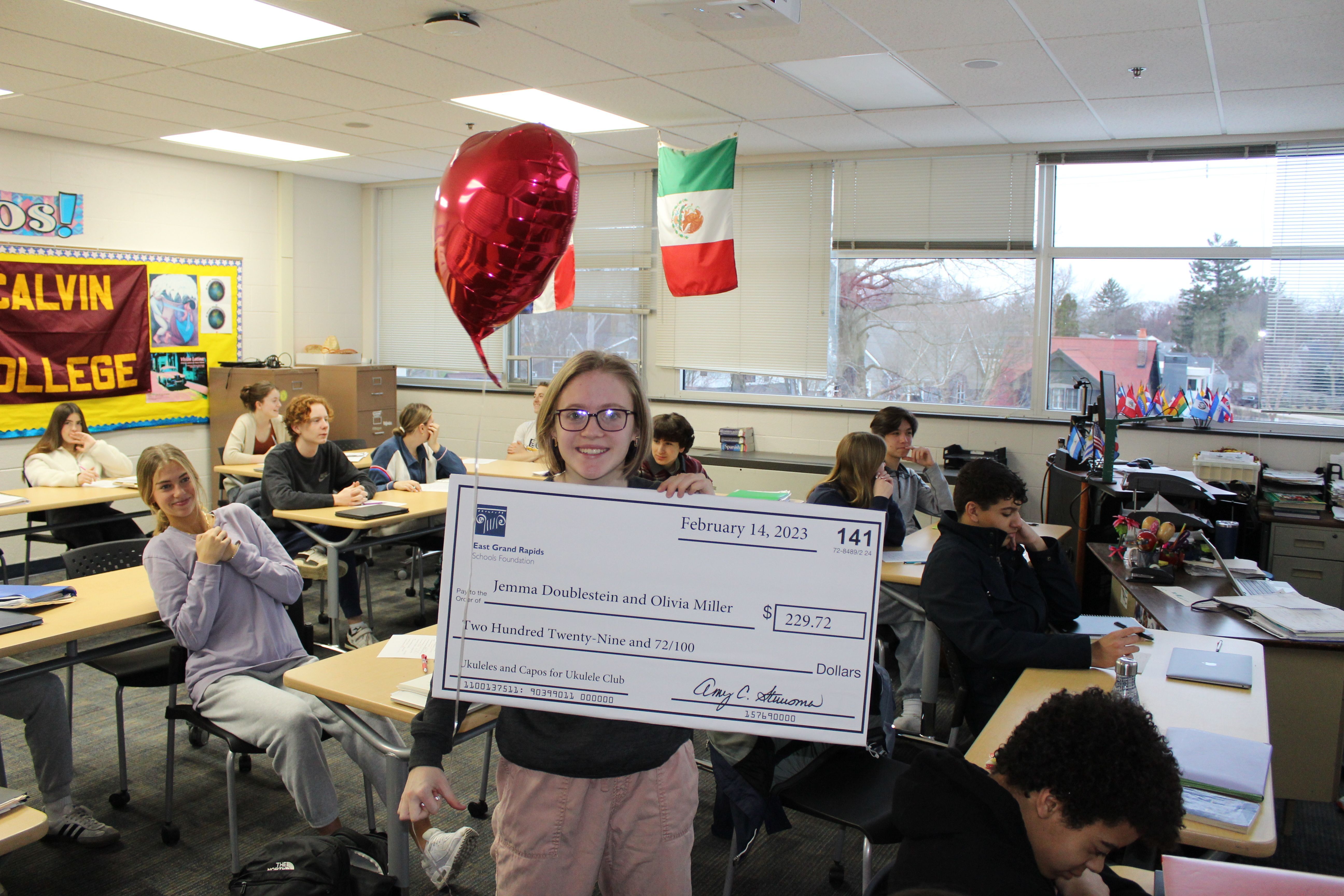 photo of student with big check