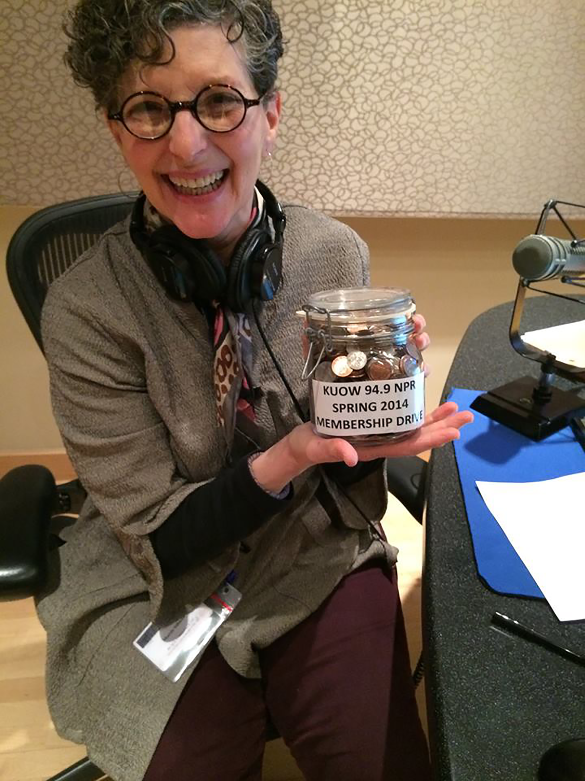Marcie Sillman with money from the KUOW Membership Drive, 2014.