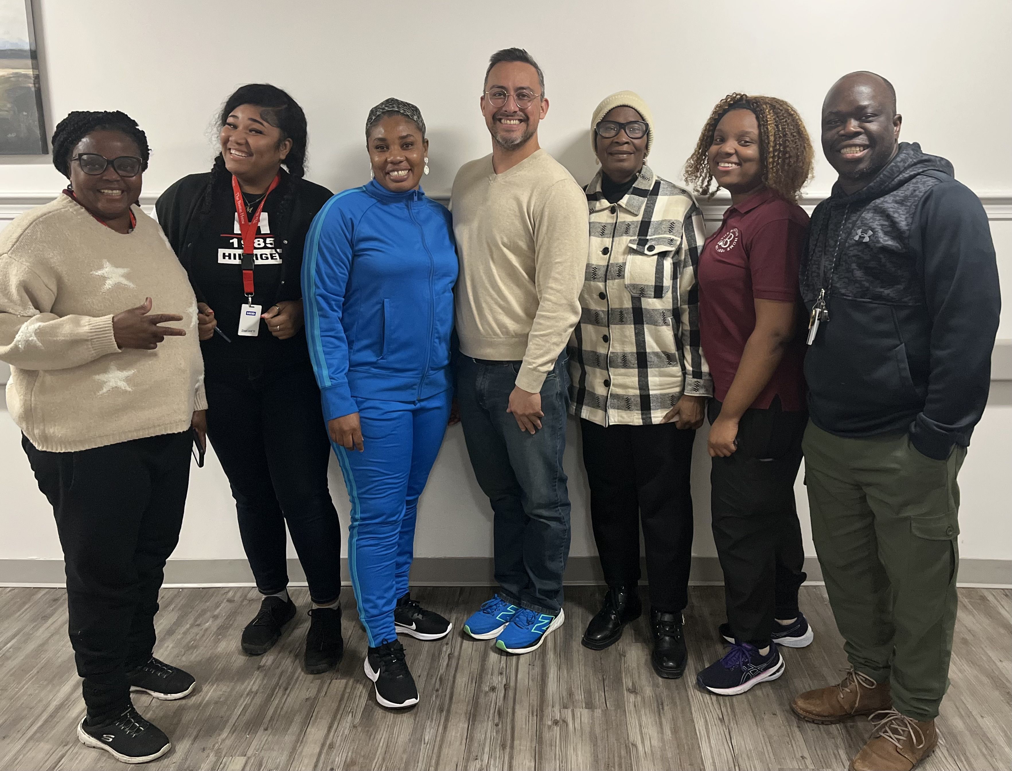 Instructor hands certificate to TBH Staff Member