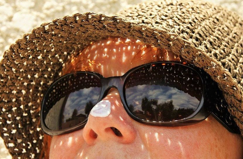 Sunscreen, sunglasses, hat