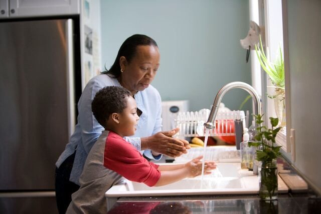 Kid and Parent Washing Hands