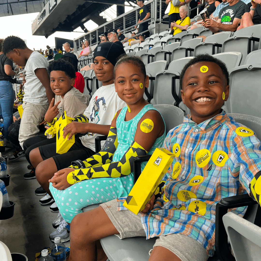 Photo featuring students in Home for Families Summer Achievers out of school programming attending a Columbus Crew soccer game