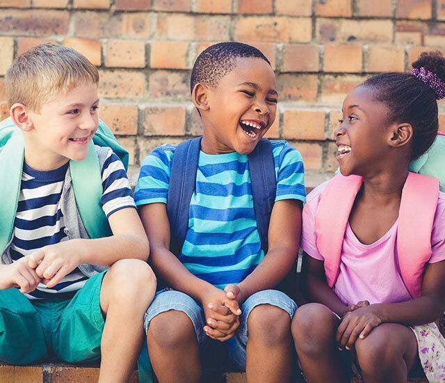 Students smiling outside