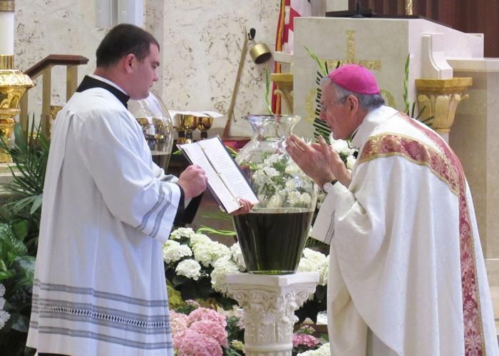 Bishop Barbarito blessing the chrism oils