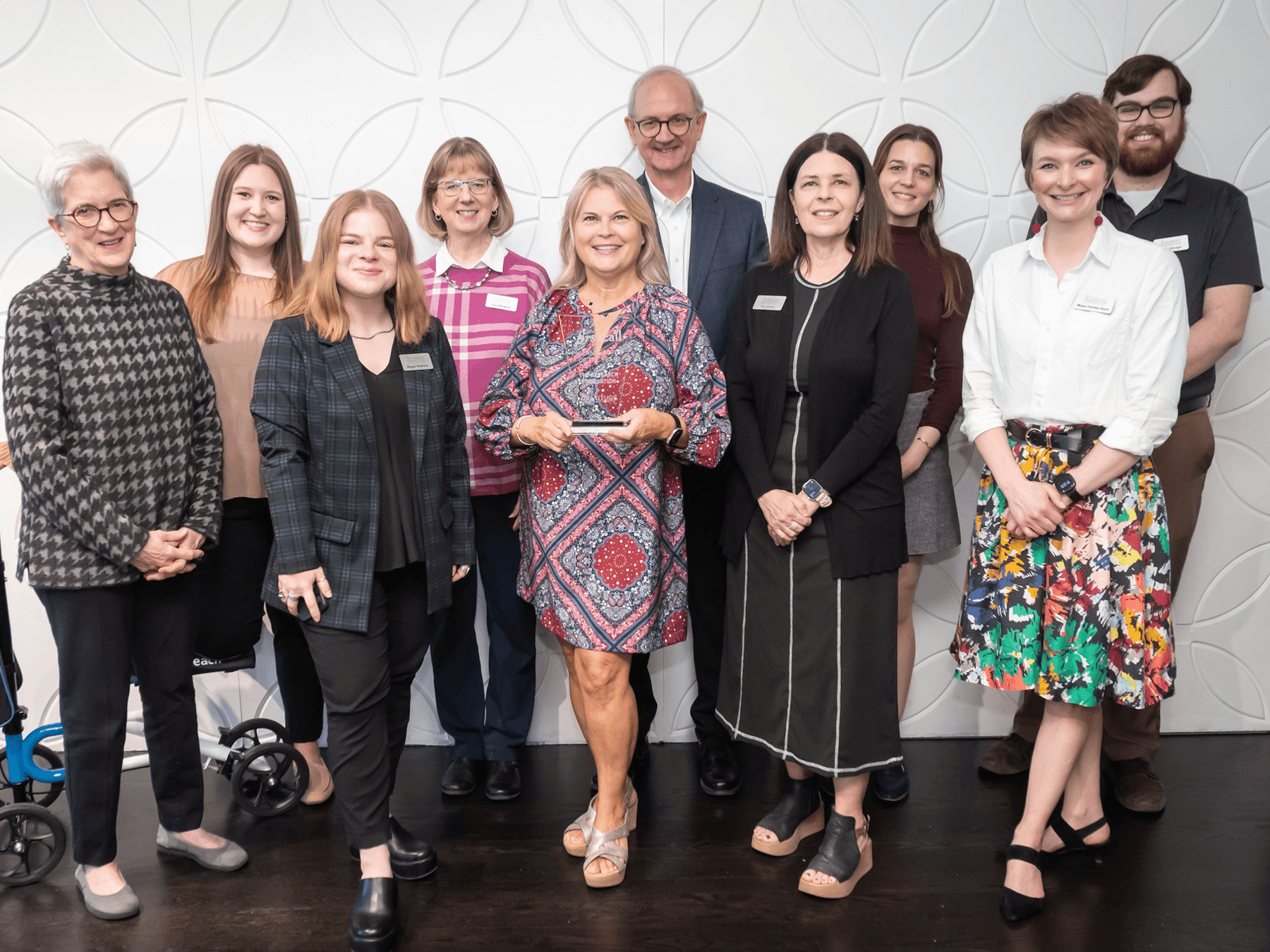 group of professionals with award