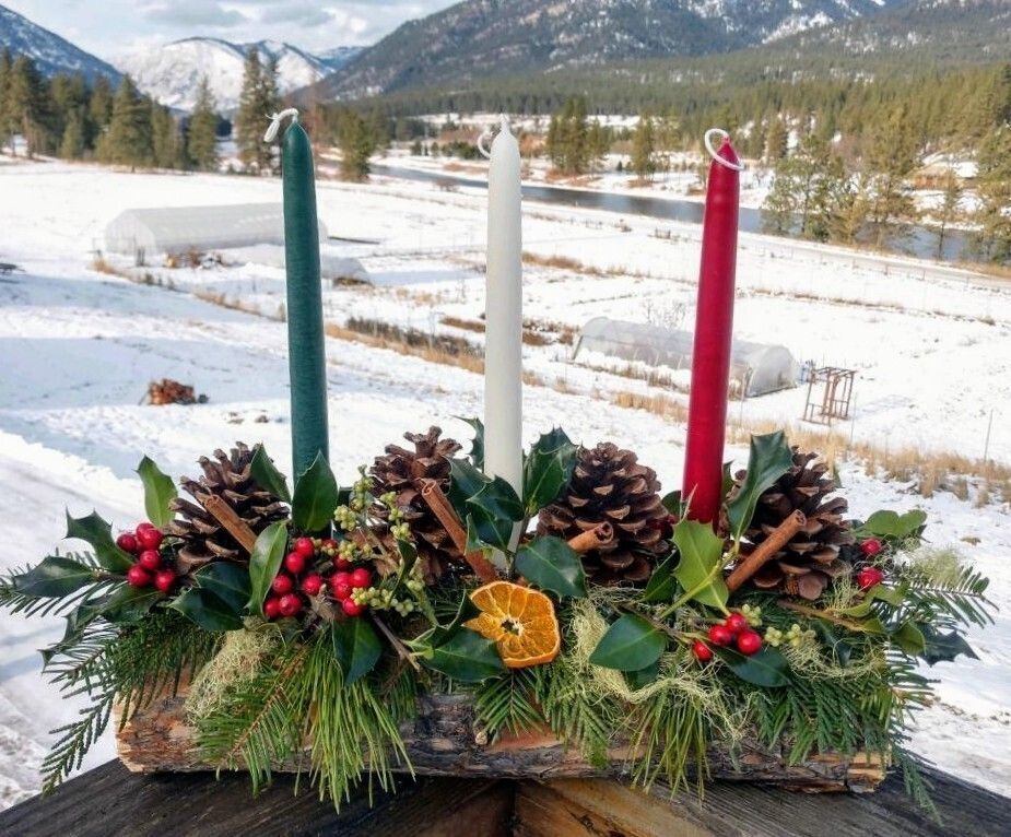 Yule log with decorations and candles