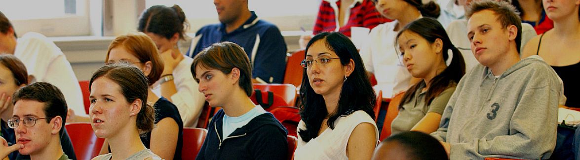 Students seated in rows in lecture hall 