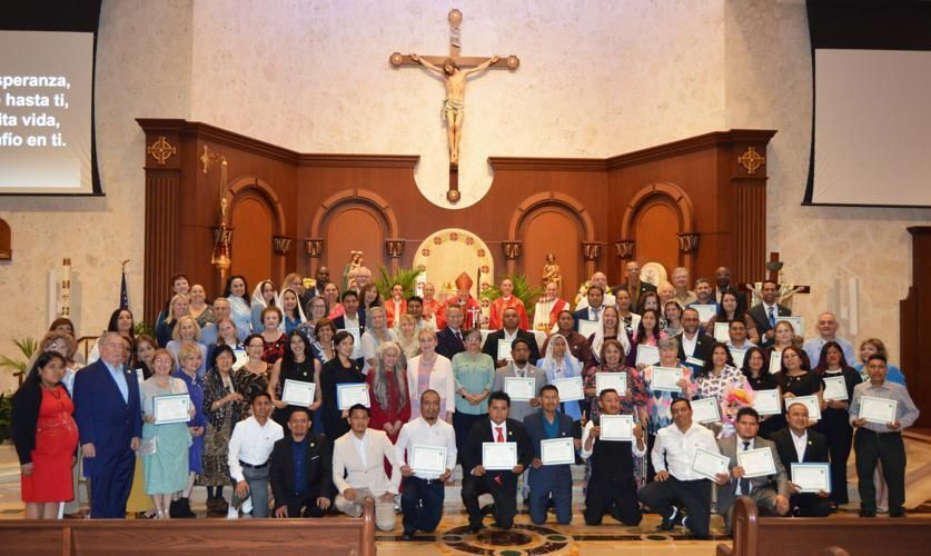 Bishop Barbarito and other clergy pose for a photo with the 2025 graduates of the School of Christian Formation.