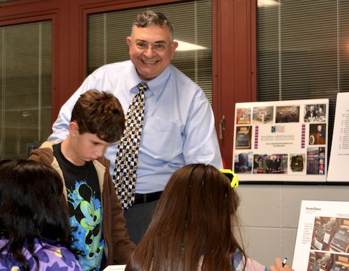 NCMF's John Garcia works with students on the Enigma Puzzle