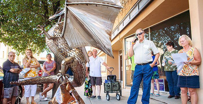 Vincent Houston explaining the inspiration behind his Fantasy Dragon sculpture