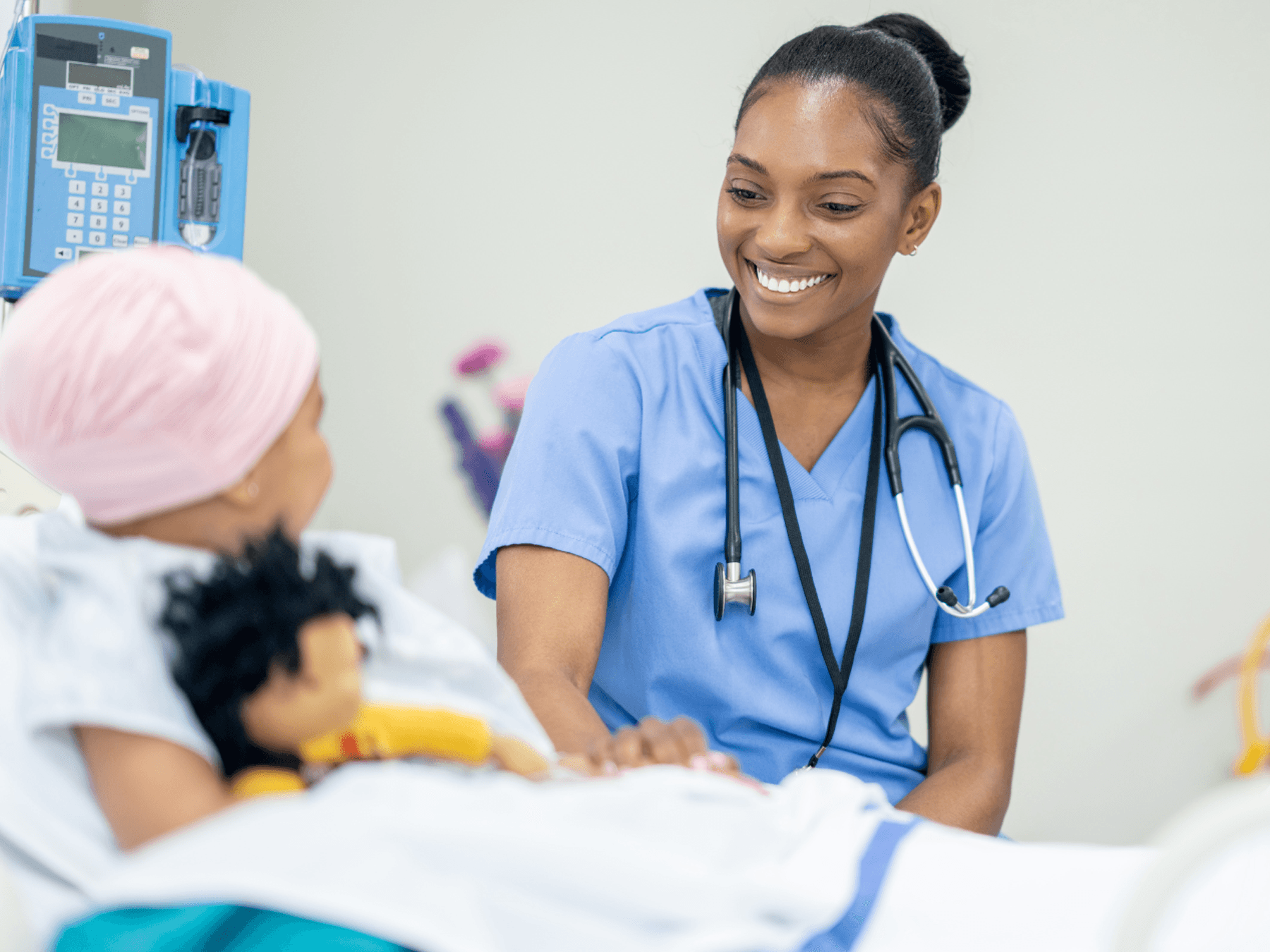 health care professional providing care for young cancer patient