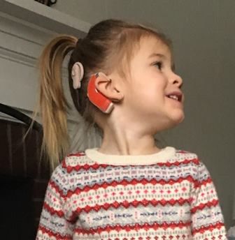 Delia wears cochlear implants.