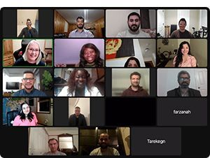 Many faces on a computer screen during a zoom session for an online class.