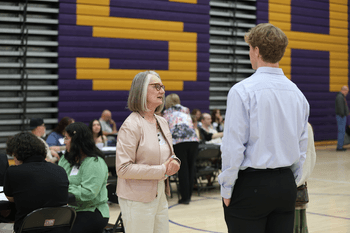 Scholarship donor chating with scholarship winner