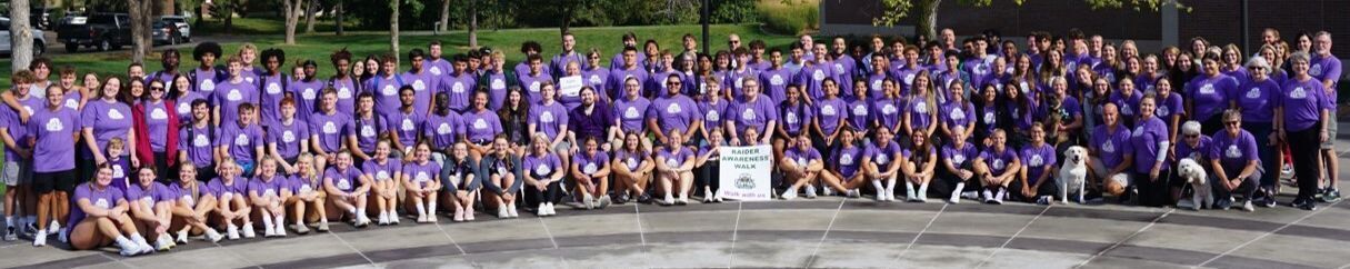 Smiling students wearing raider suicide awareness shirts