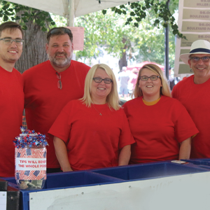 Group of volunteers in red shirts at Main Street Music Festival