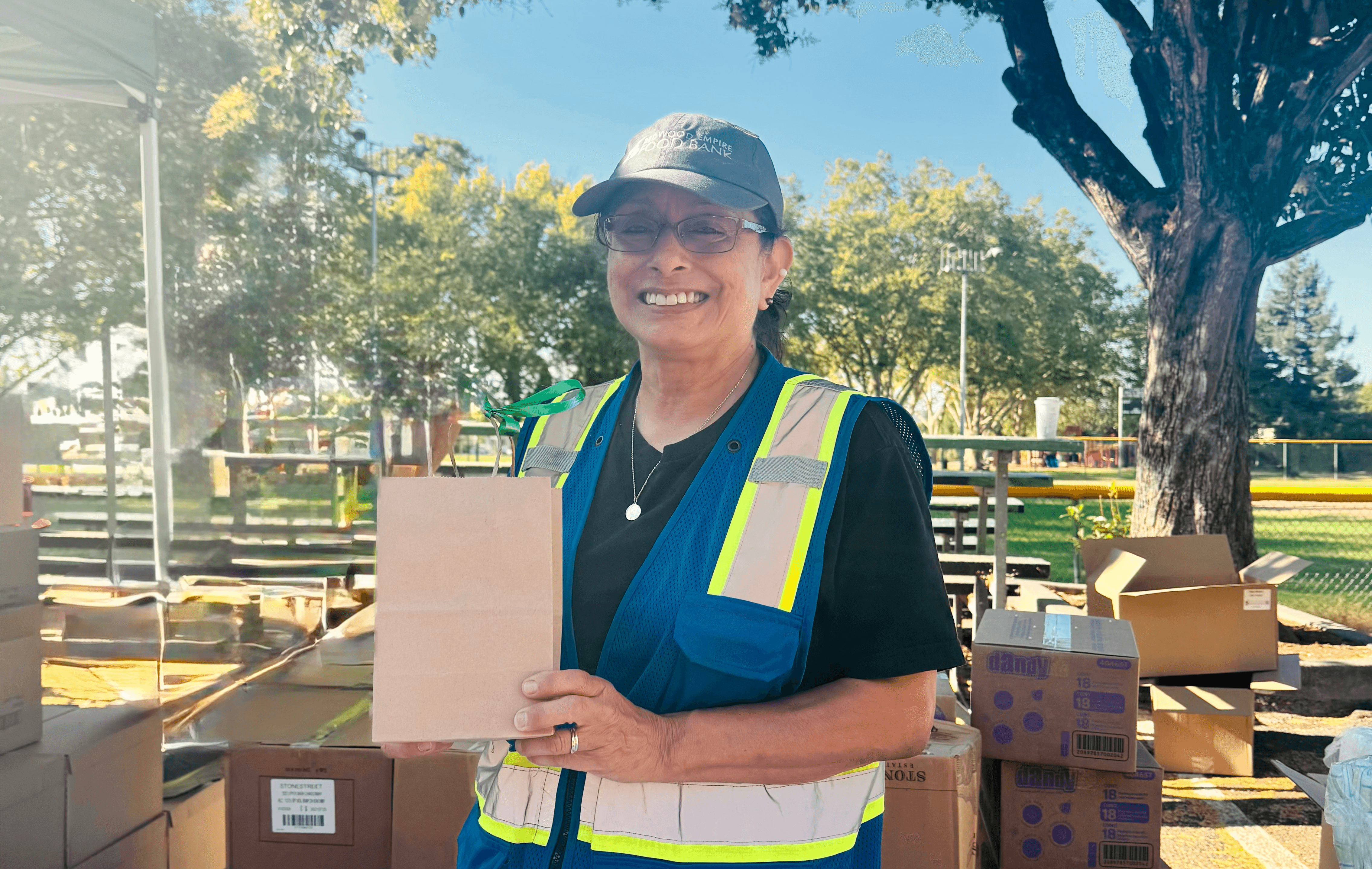 Julie V. celebrating her 1,000 hour milestone at a Distribution Site.