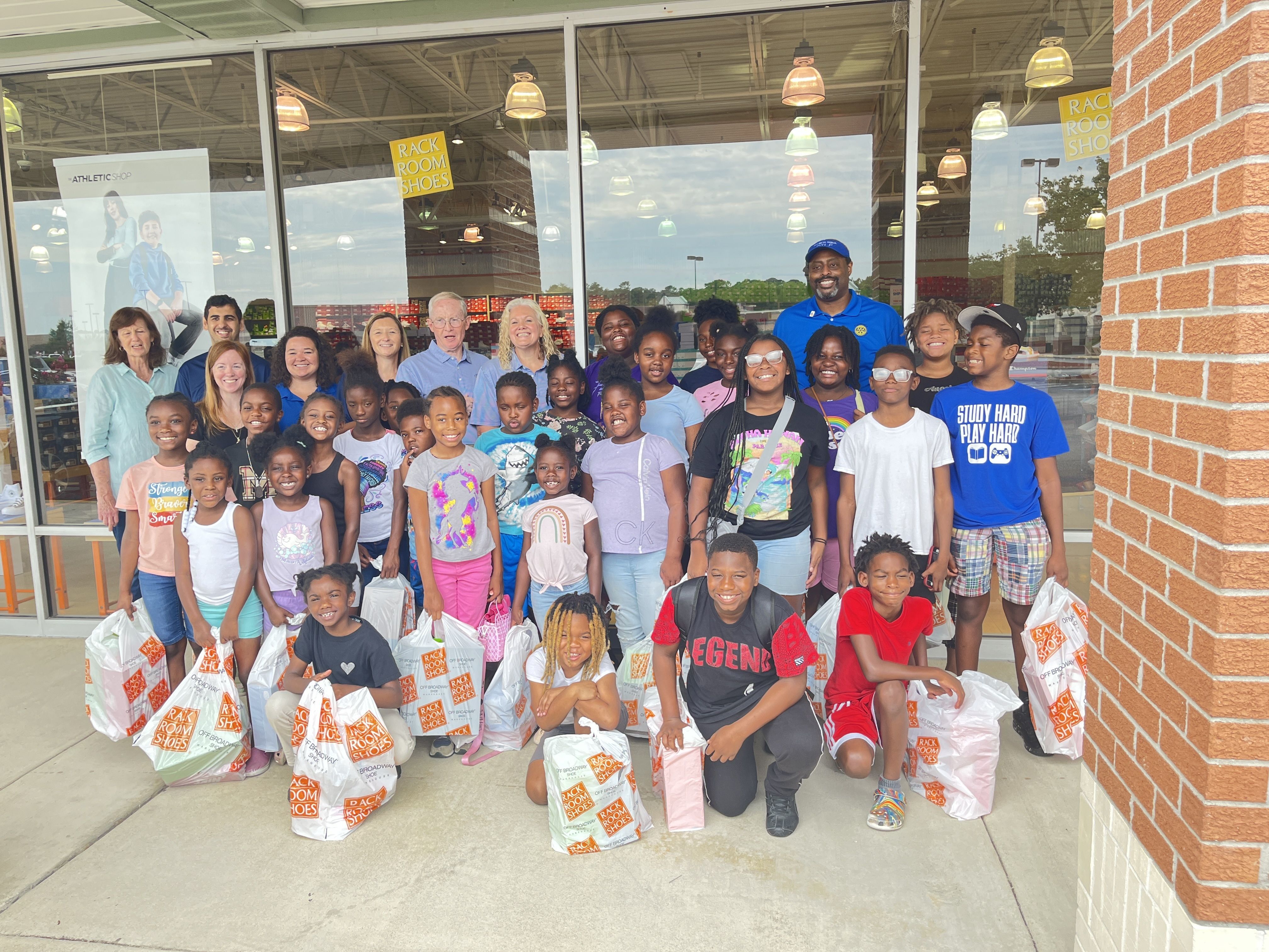 Florence Breakfast Rotary Club members bought new shoes for 100 Boys & Girls Club youth to start the school year off right.