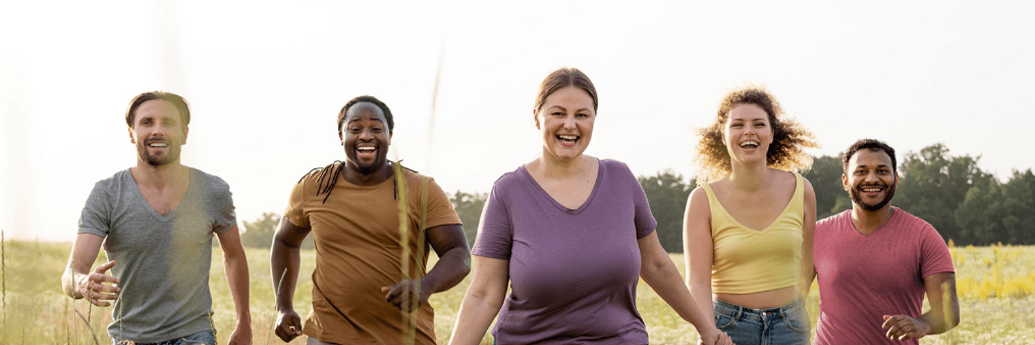 Photo of multiple people walking in a field