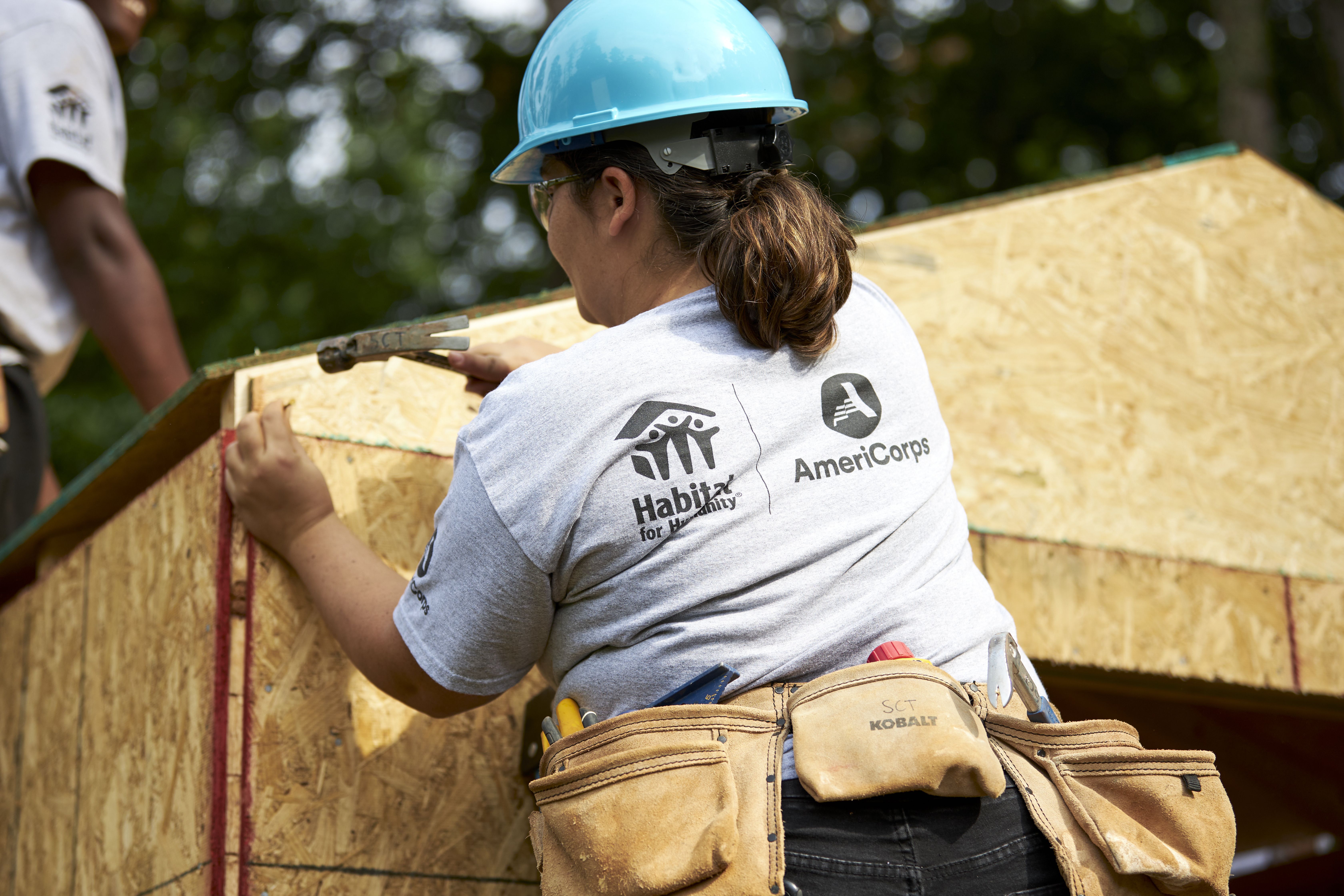 AmeriCorps working on a house for Habitat for Humanity 