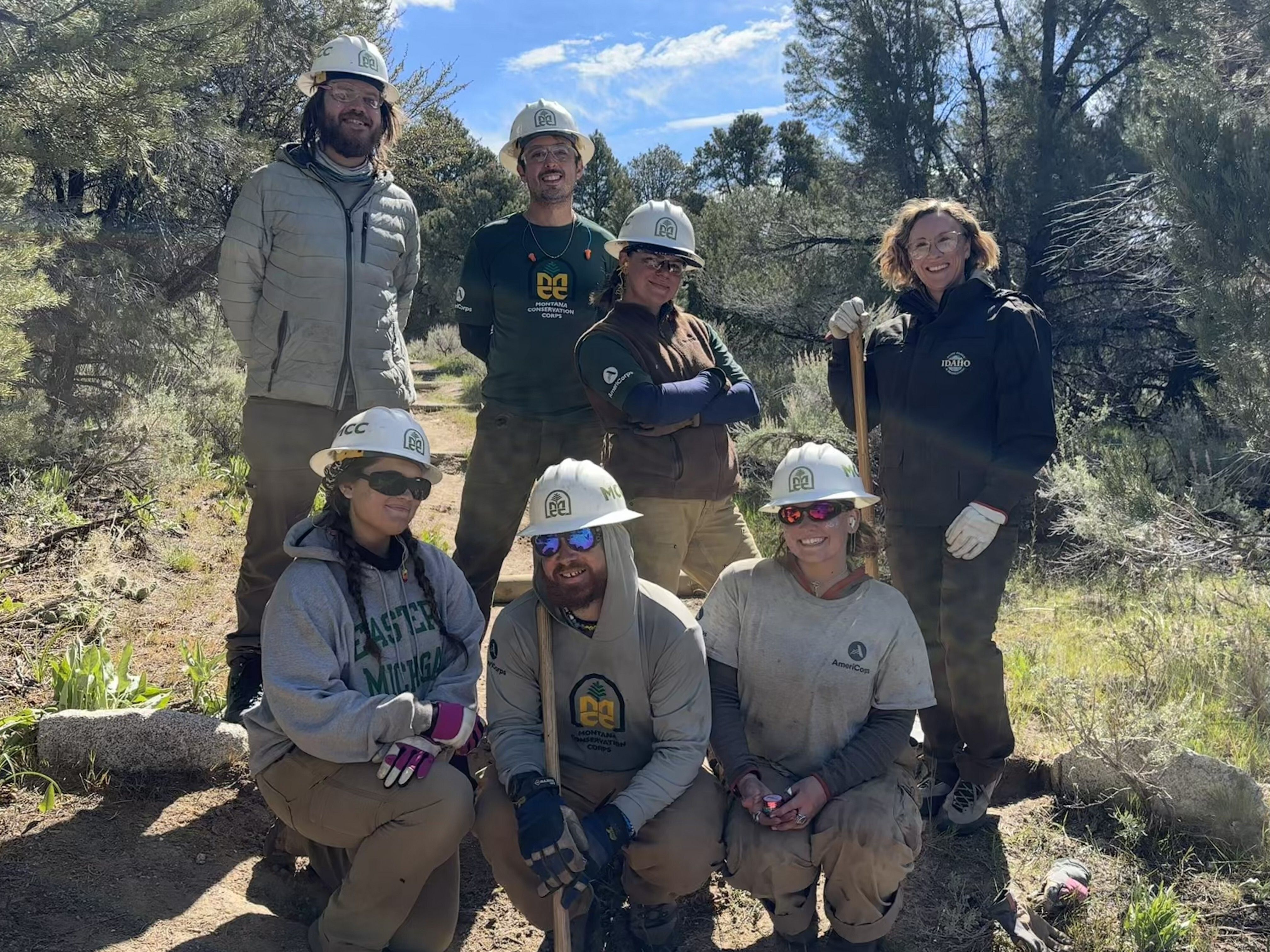 A group of MCC Crew Leaders huddle together for a selfie. 