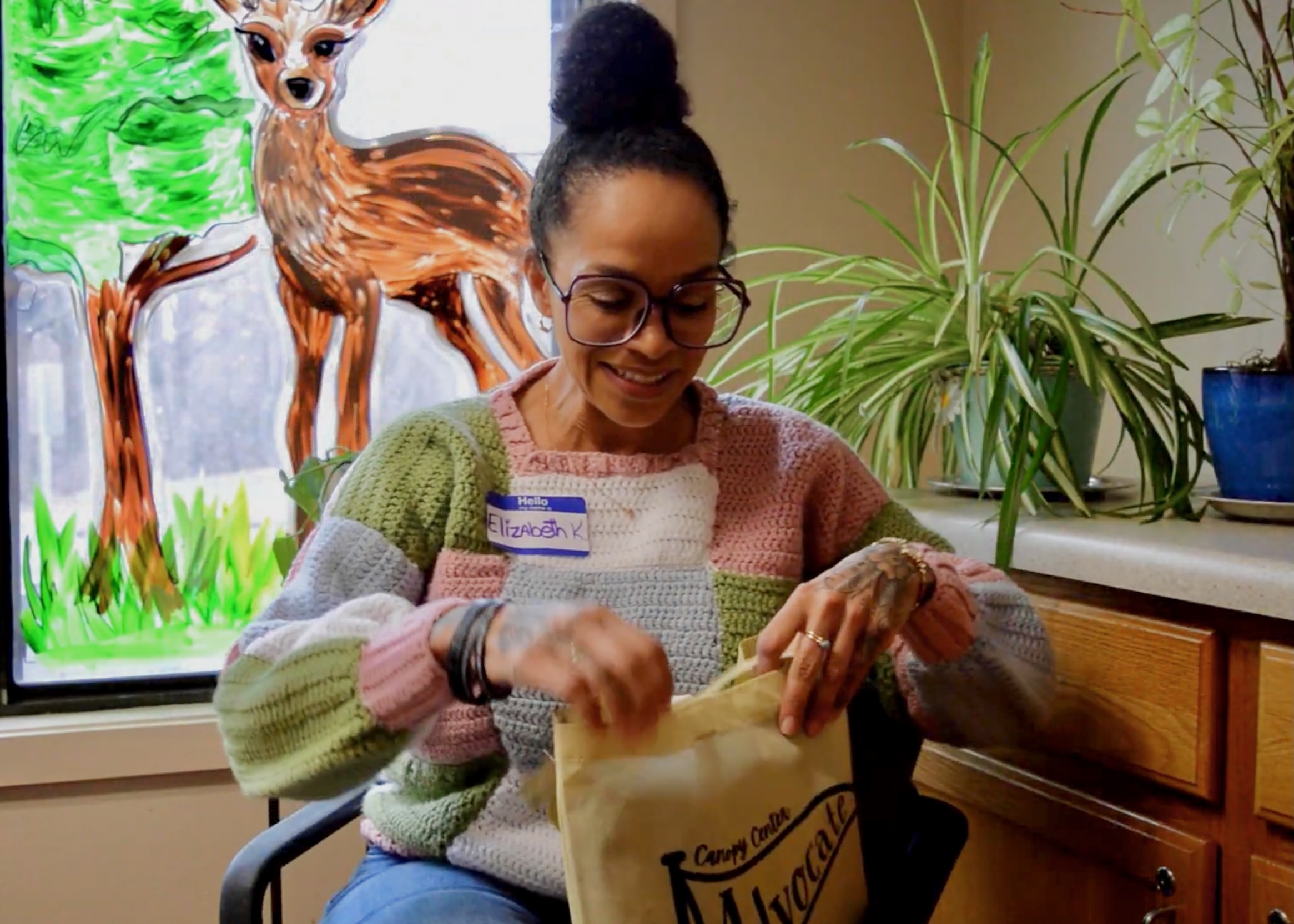 Elizabeth holds up her advocate bag