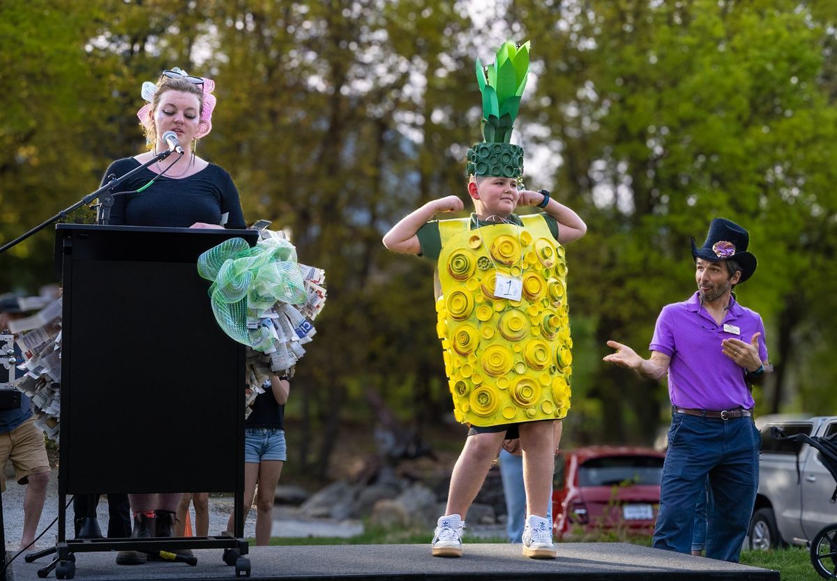 2025 Trashion Show participant posing on stage in his pineapple costume, accepting his prize.
