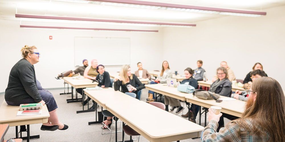 People sitting at long tables