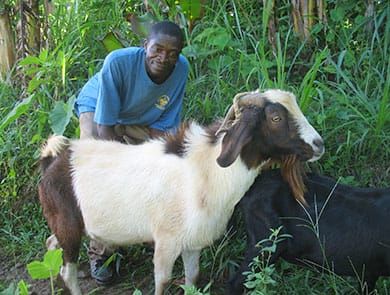 Farmer from the Marinette nursery area poses with his goat.