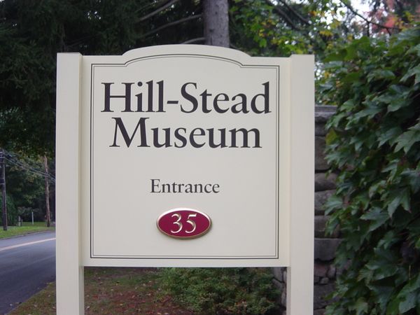Post & Panel Entrance Sign, Vinyl Graphics on Dimentional Aluminum Panel with Raised Carved & Gold Leafed  Overlay Detail