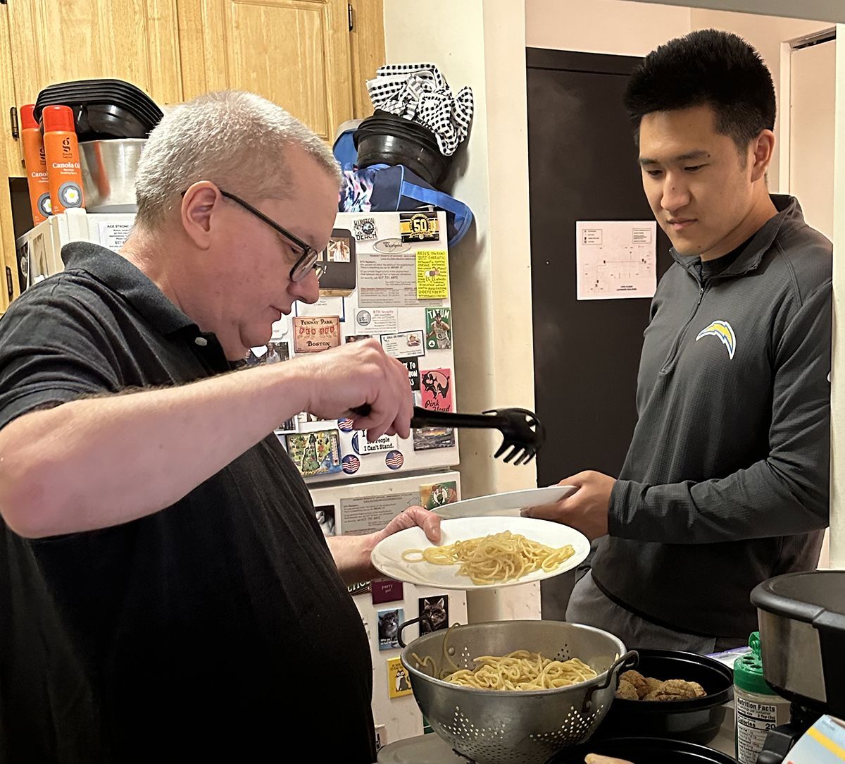Friendly Visiting program participant dishes out lunch.