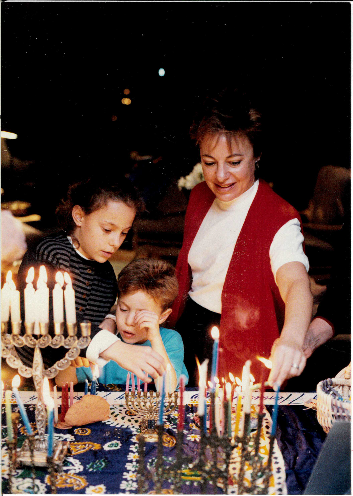 Michele and two of her three children, Mimi and Jack [Leslie not pictured], during Chanukah.