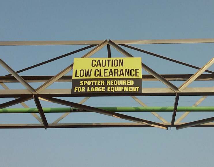 Custom ADA-compliant signs including restroom, wayfinding, and room identification signs for a medical office