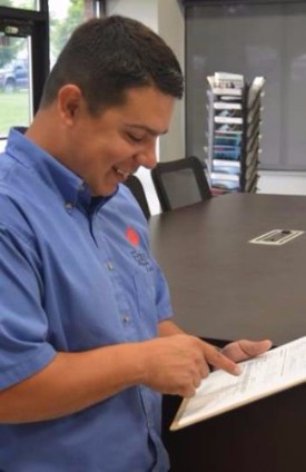 Eakes Employee Standing with Clipboard