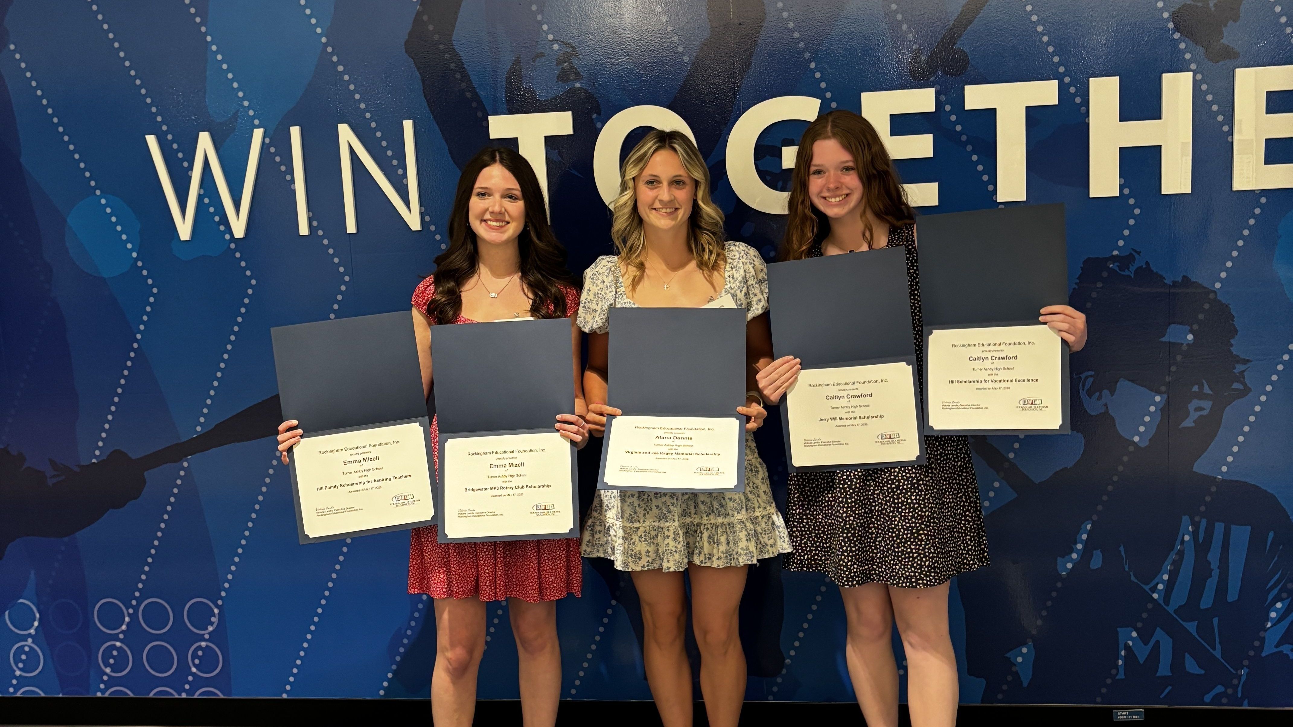 student and donors holding scholarship certificate