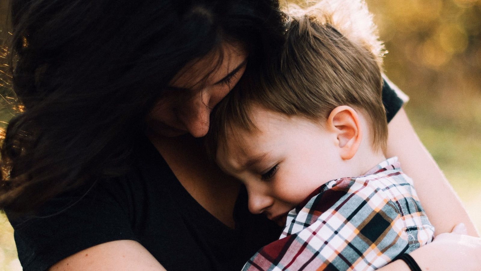 Mother holding and upset toddler