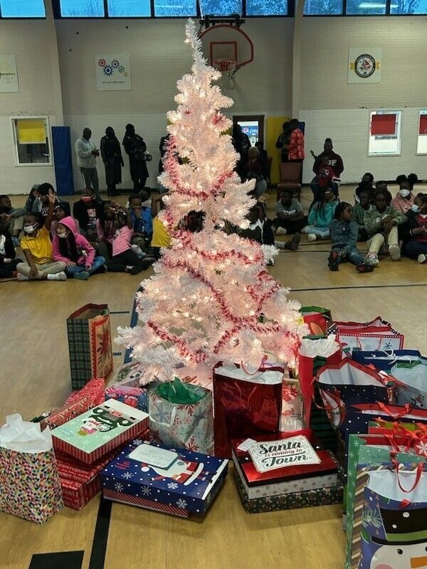 Presents surround a Christmas tree at the Lake City Boys & Girls Club & Youth Technology Center