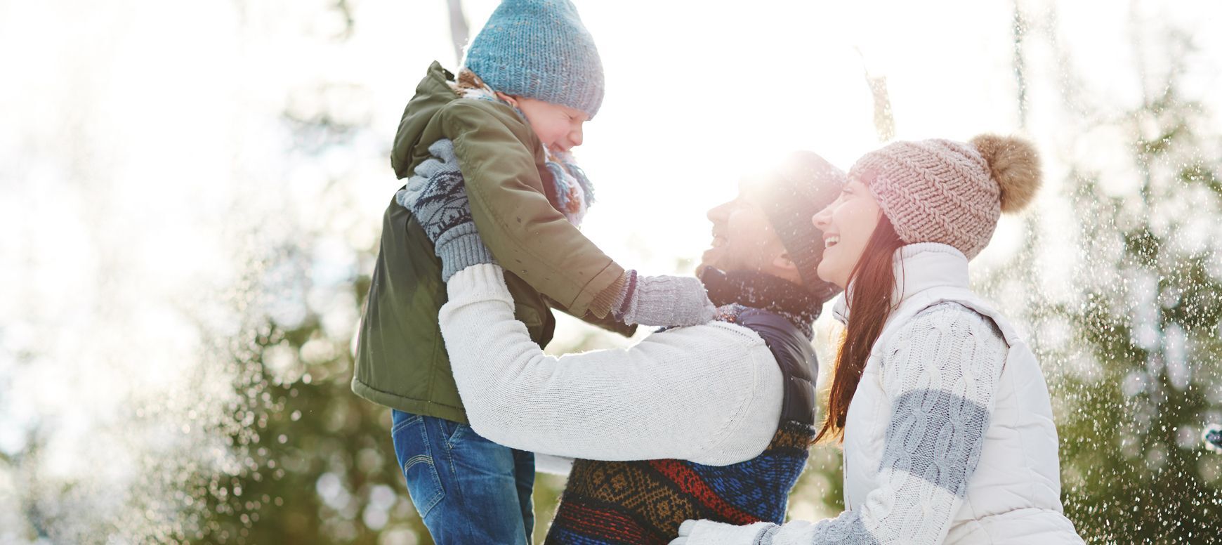 family playing in winter weather