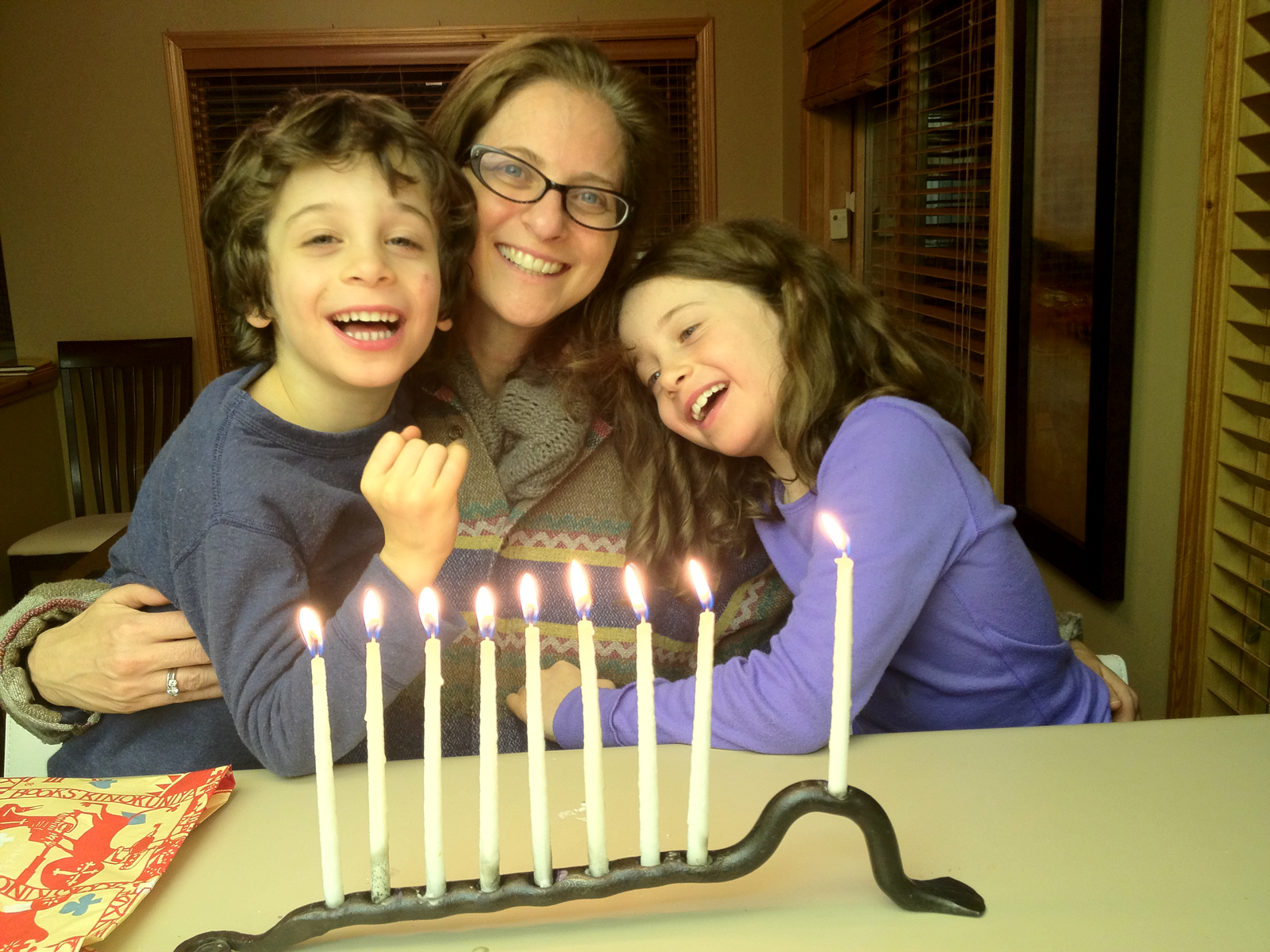 Michelle and her children on the 8th night of Chanukah.