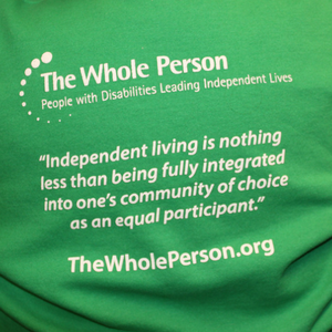 Graphic reading "What do you call a person with a disability? A person." TWP Logo and website address