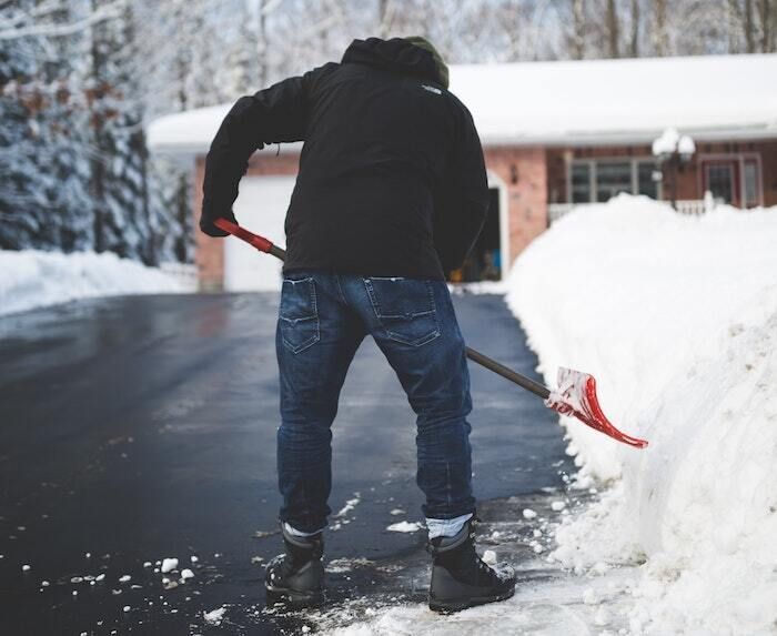 Person shoveling driveway