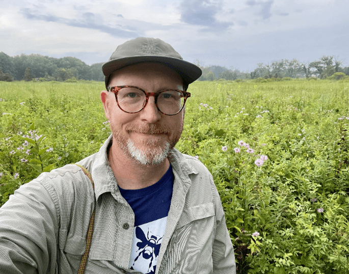 Profile picture of Clay Bolt with field in the background.