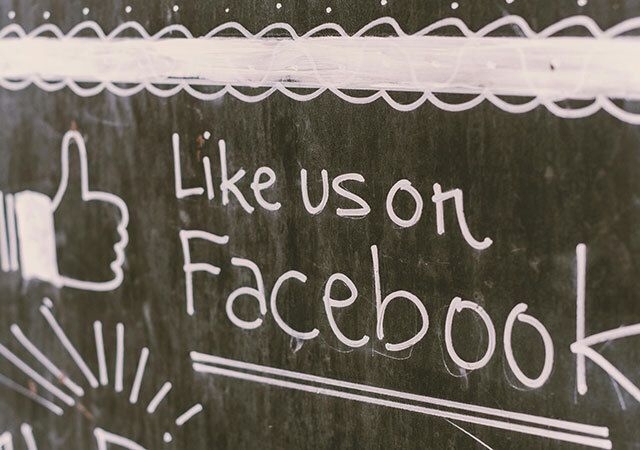 Sign that says Like Us on Facebook.