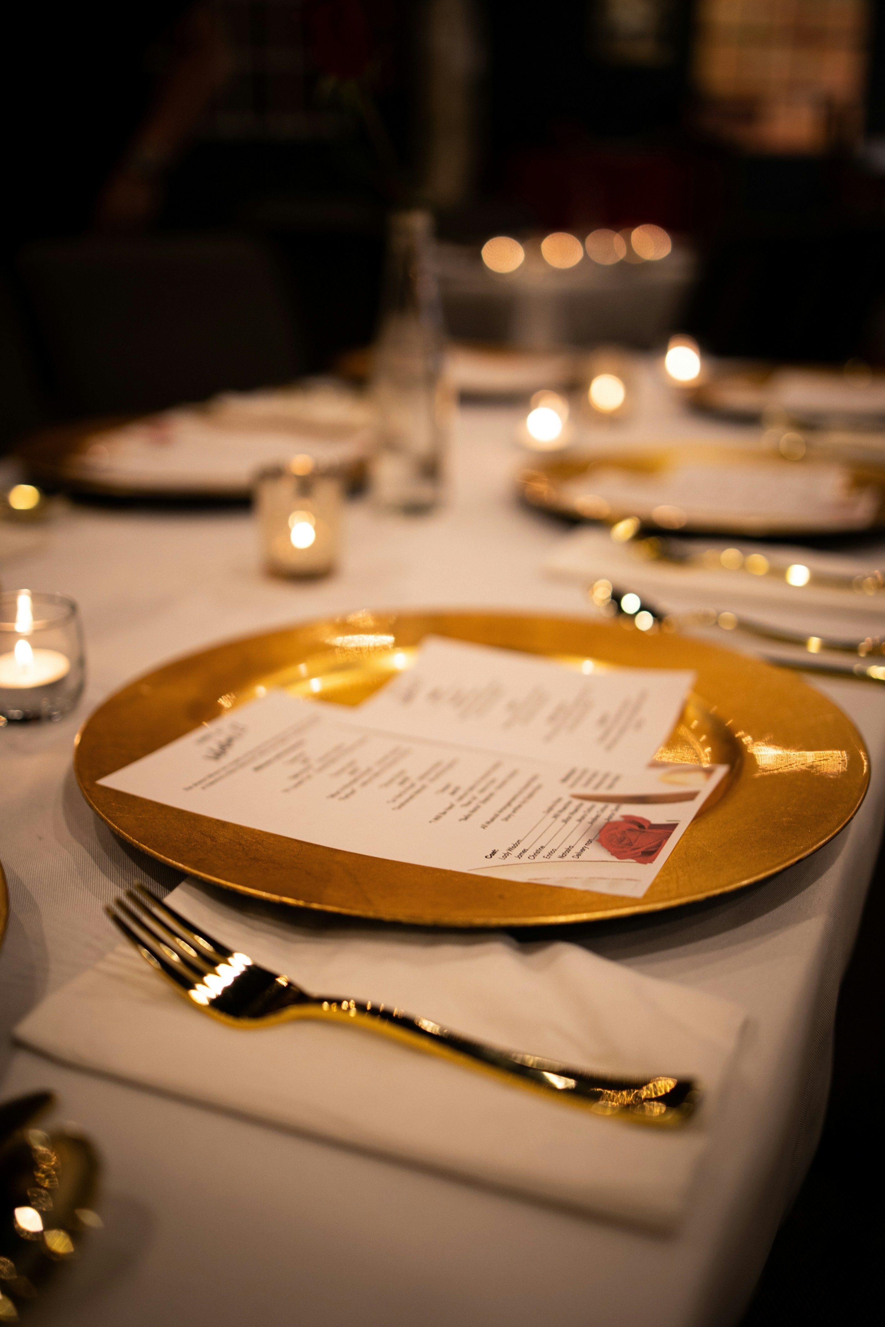 place setting with invitation at a fancy dinner