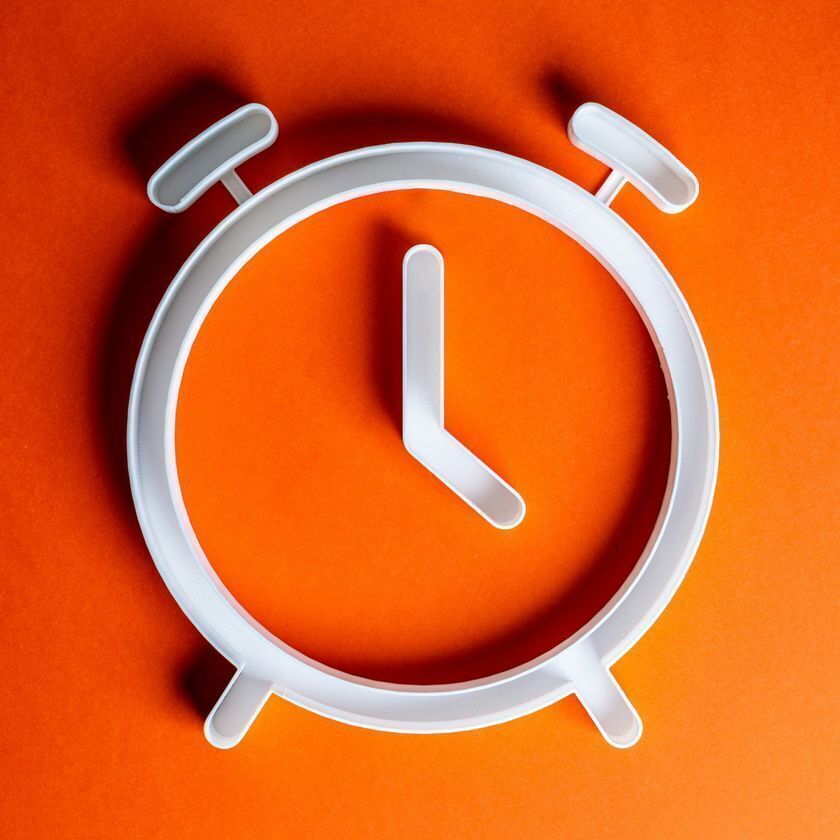 Silver Clock with Orange Background
