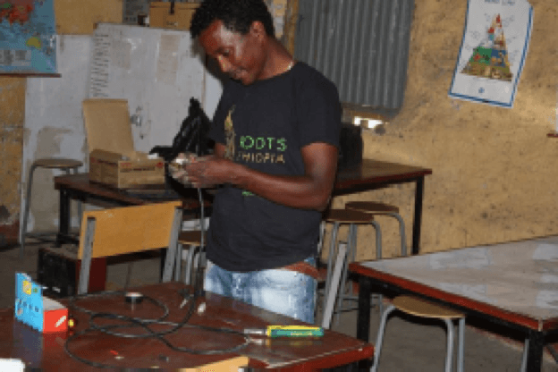 Man working on wires.