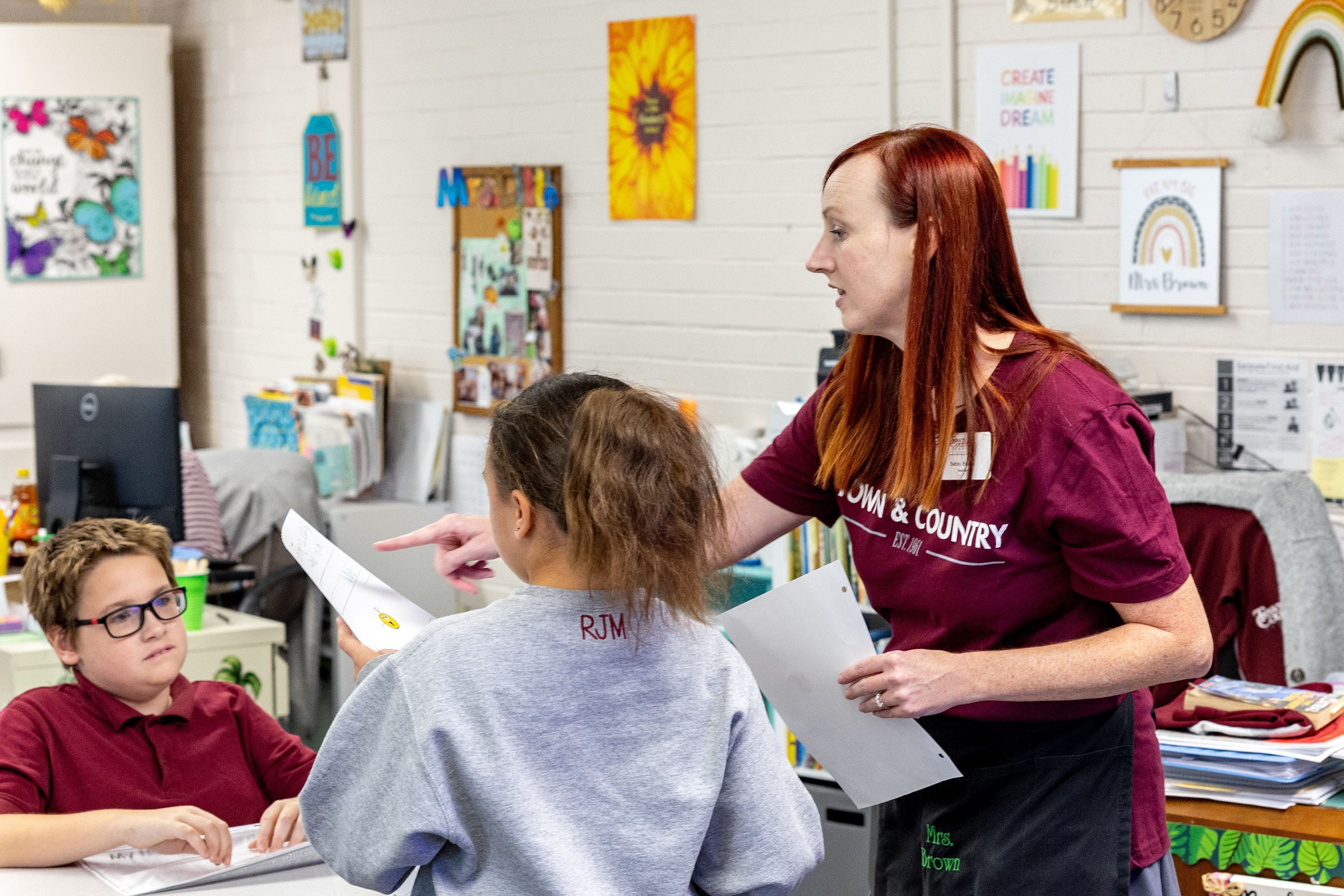 Teacher working with students