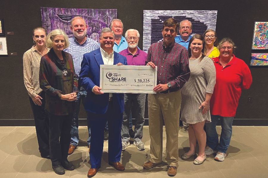 FFB Representative & Committee Chair, Scott Walker and Dr. Brian Jones, SHARE Foundation President hold check announcing total proceeds raised by the SHARE Benefit Golf Tournament of $30,225 surrounded by Golf Committee Members.