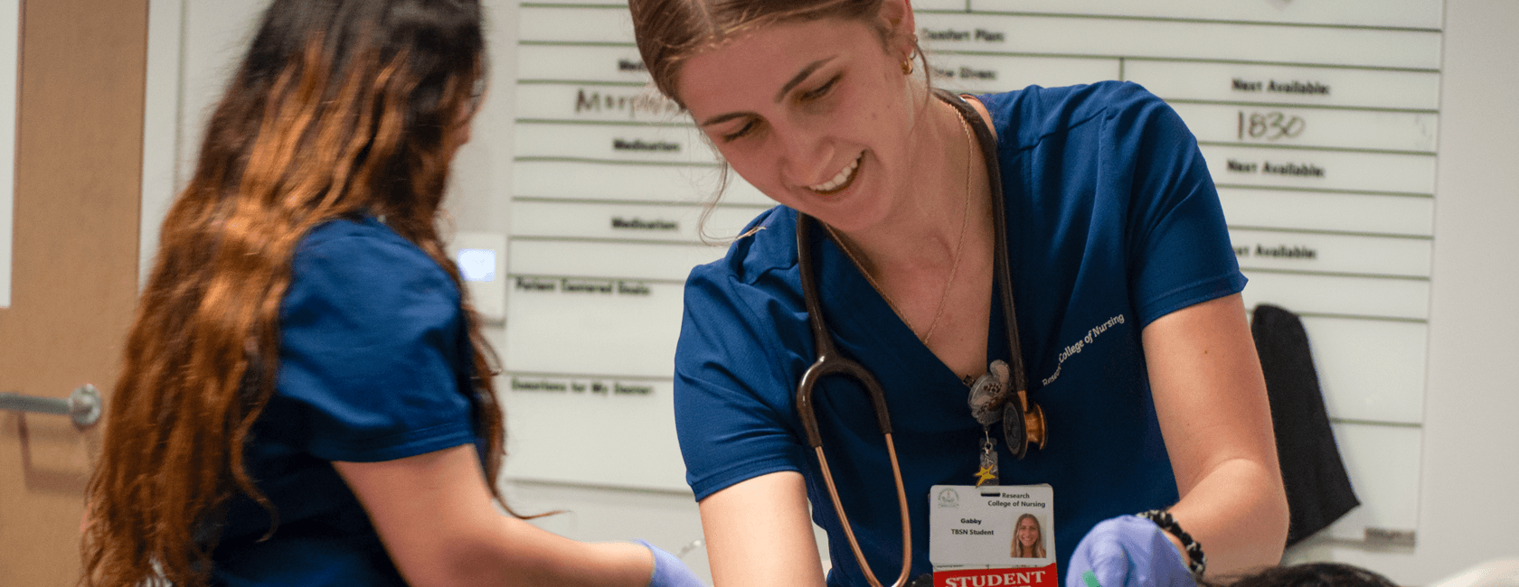 nursing students placing oxygen mask